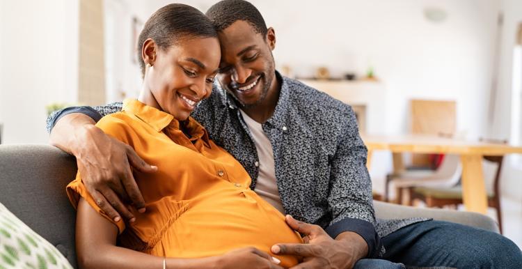 a pregnant woman and her partner 